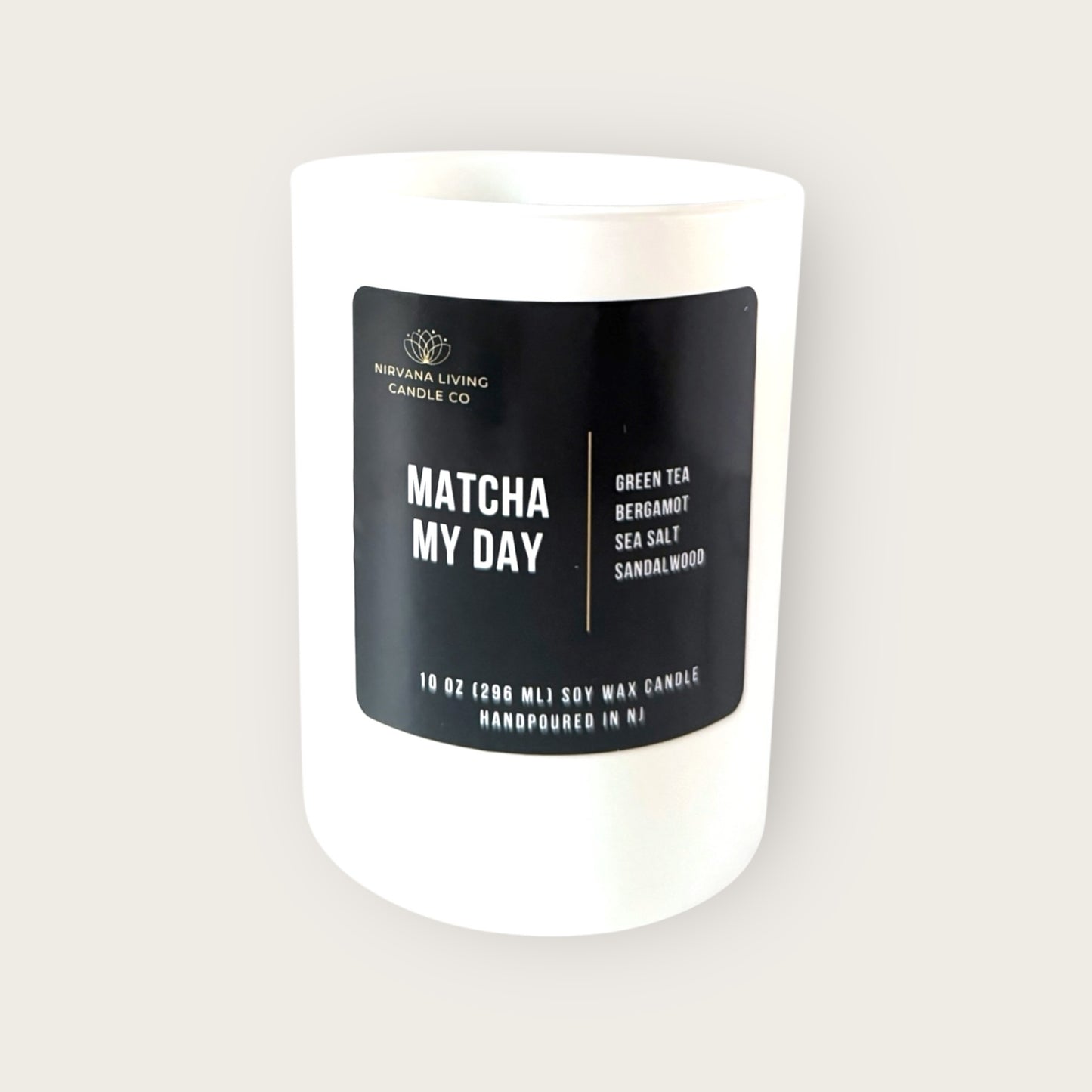 Hand-poured soy candle with a matcha scent in a white jar