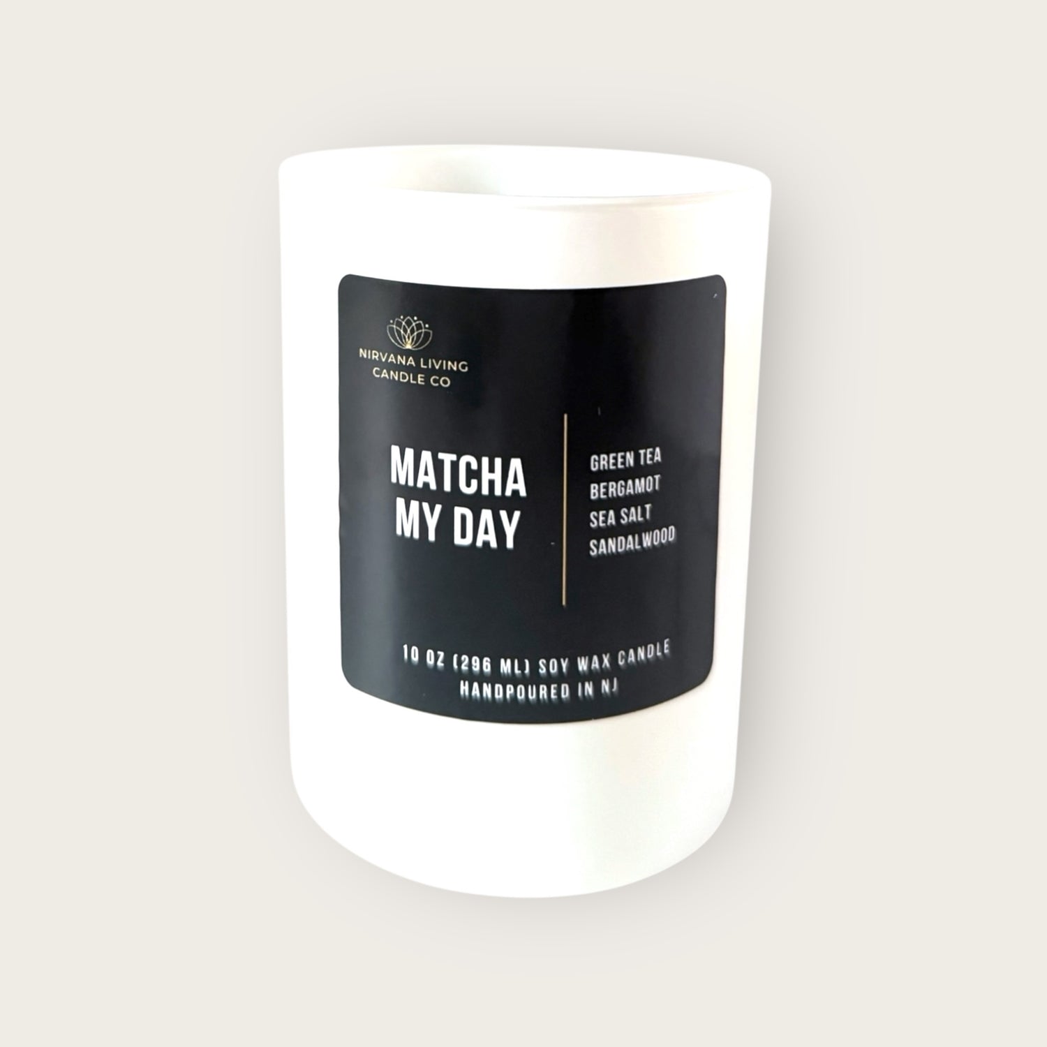 Hand-poured soy candle with a matcha scent in a white jar